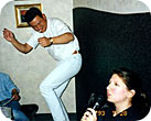 Indulging, somewhat reluctantly, in a bit of karaoke with friends. The dancing guy is Hiro the fireman. Photographer unknown