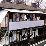 Yoshida House #3. I'm waving my arms in front of my room. Standing next to me is my boyfriend, who lived upstairs because of the rooms being too small for successful cohabitation. Photographer unknown