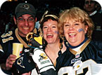My husband (Jon Schmuke), Beth Wiggins (a.k.a. RamXena, Football Warrior Princess) and Kathy Lewis (a.k.a. Ram Rat Kath, the 2002 Ultimate Rams fan) at the playoff game against the Green Bay Packers last year. Note the rat Kathy is holding is dressed in a Packers jersey.